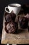 Three Tasty Homemade Chocolate Muffins in Paper and White cup of Cocoa Wooden Background Dark Photo Tasty Dessert