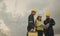 Three technician engineer in uniform with standing and checking wind turbine power farm power generator Station. Clean energy and