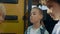 Three teen children standing at open bus door closeup. Boys talking together.