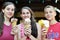 Three Teenagers Enjoying Waffle Ice Cream Cones