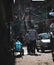 Three Teens Passing by Narrow Thamel Street