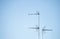 Three television antennas for analog and digital terrestrial television installed on mast on a roof in Spain, with grill and
