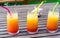 Three tequila sunrise cocktails