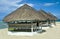 Three thatched huts on the beach by the sea