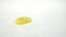 Three thin slices of lemon roll on the water. White background. Slow motion