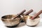 Three Tibetan bowls on the table.