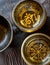 Three tibetan singing bowl on top of a wooden table