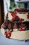 Three-tier cake adorned with assorted vibrant berries