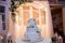 Three tier white wedding cake with decor and flowers