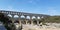 Three-tiered aqueduct french Pont du Gard bridge in provence natural park
