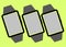 Three tilted dark grey black modern digital fitness tracking wrist watches light luminous green backdrop