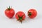 Three tomatoes (Solanum lycopersicum)