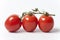 Three Tomatoes On A Vine On White Background