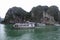 Three tourists boats near the islands of ha long bay Vietnam