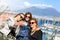 Three tourists take a selfie in front of Vesuvio