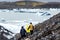 Three tourists will be on an iceberg in Iceland