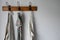 Three towels hung up on a coat rack