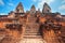 Three towers and long stairs of ancient temple in Angkor. Cambodia