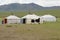 Three traditional Mongolian yurts in steppe, circa Harhorin, Mongolia.