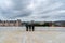 Three travellers enjoying the beautiful view from Norwegian National Opera and Ballet building in Oslo. August 2019