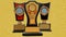 Three trophies - golden orange and black colored in golden textured background