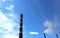 Three tubes Krasnoyarsk power plant against the sky