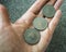 Three Tunisian coins on the woman\'s palm