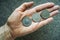 Three Tunisian coins on the woman\'s palm