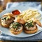 Three turkey burger sliders with fries  on plate