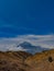 three twin mountains rising high into the sky