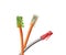 Three twisted pair cables with red, green, and yellow jacks isolated on white