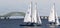 Three two person sailboats with The Great South Bay Bridge in December