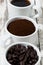 Three types of coffee - ground, grain and beverage in cups