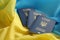 Three Ukrainian biometrical passports on folded waving flag of Ukraine country