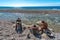 Three unidentified boys cleaning freshly caught fish on Playa Sana Rafael in Dominican Republic