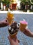 Three unique ice cream in the hands of 3 friends in Przemysl, Poland.