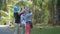 Three unrecognizable girls take pictures of sights. Group of tourists in tropical forest in Sri Lanka