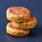 Three vegan burgers, patties on black background