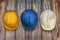 Three vintage construction helmets on a wooden wall