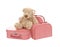 Three vintage red and white suitcases with teddy bear