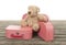 Three vintage red and white suitcases with teddy bear