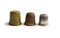 Three vintage thimbles stand in a row isolated on a white background.