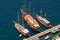 Three vintage wooden ships on Santorini island