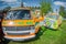 Three Volkswagen Transporter colorful on the meadow