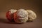 Three Walnut walnuts on a dark brown background