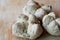 Three walnuts breads on a wooden cutting board