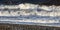 Three waves coming ashore on beach at Fleetwood