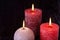 Three wax flame candlelight in dark romantic light, love dating