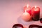 Three wax flame candlelight with red ribbon on white background, love dating, Valentine`s day
