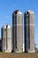 Three weathered silos against blue sky in rural United States